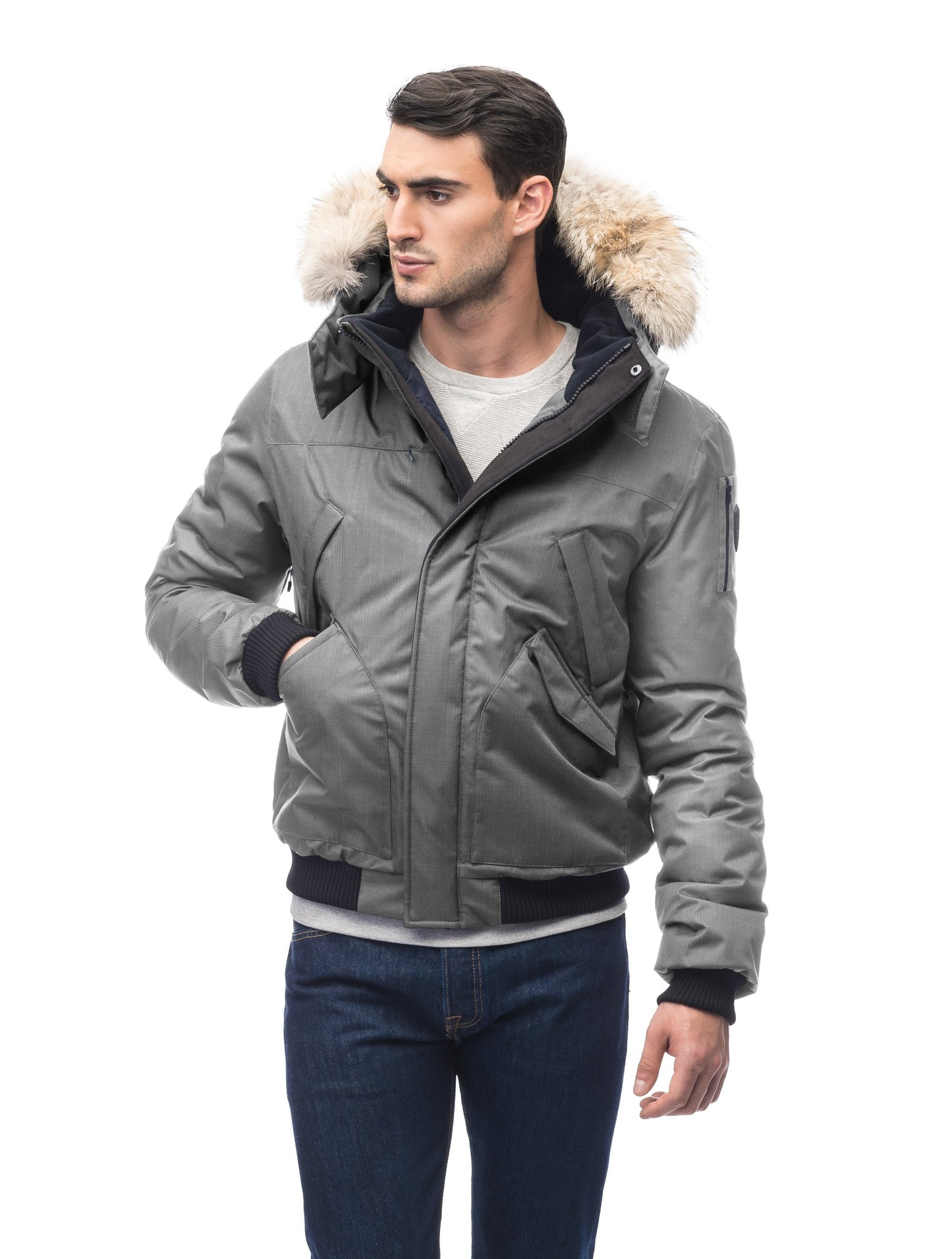 Men's classic down filled bomber jacket with a down filledÃ‚Â hood that features a removable coyote fur trim and concealed moldable framing wire in Concrete