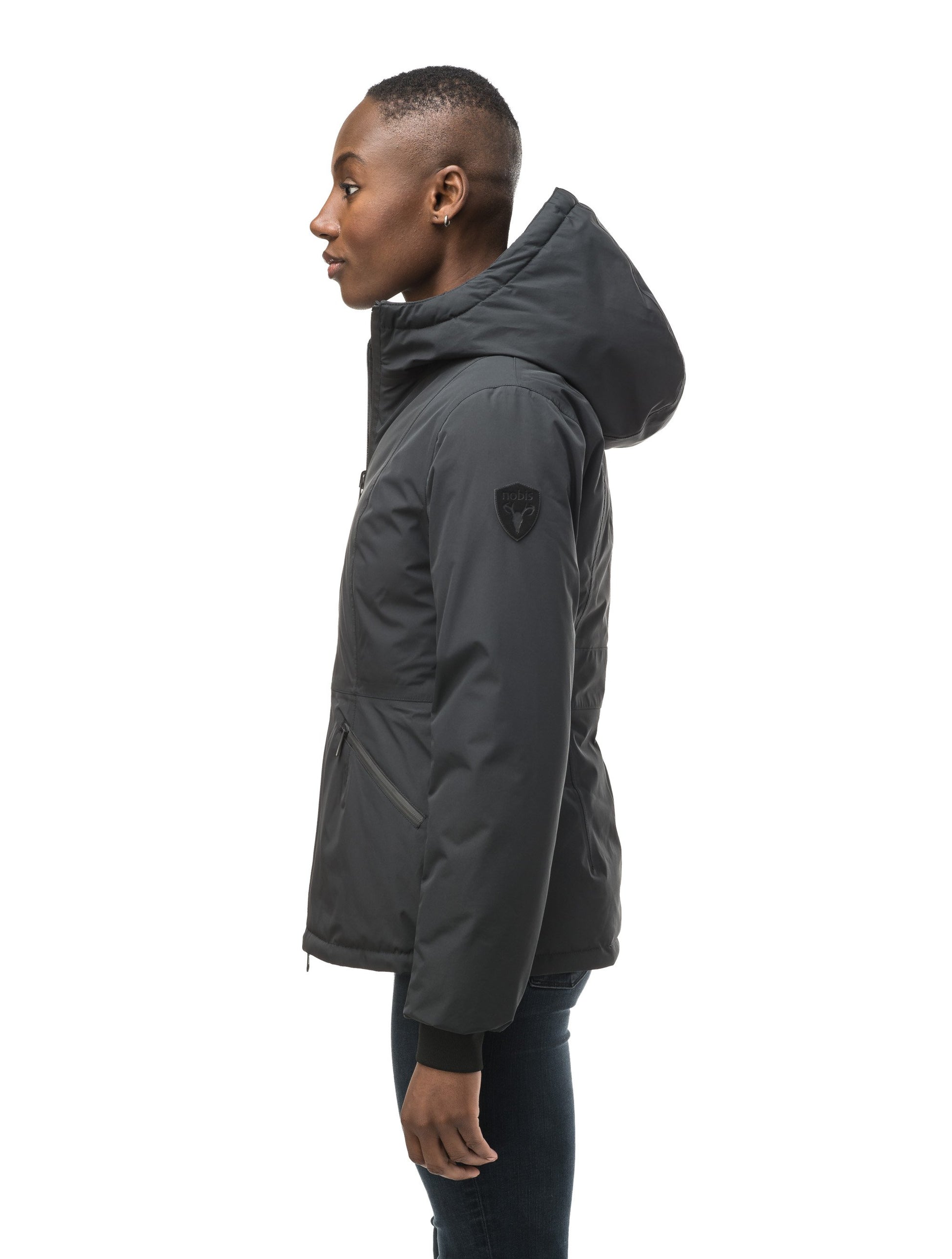 A women's two in one reversible hip length down jacket, one side is quilted and one side is solid waterproof fabric in Black