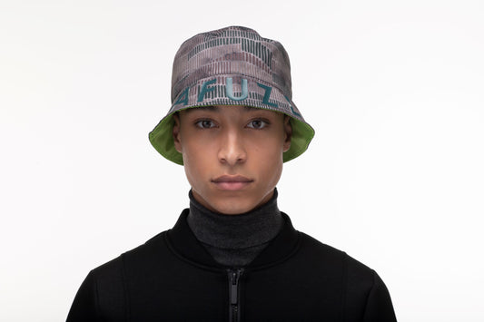 Unisex reversible bucket hat with one side in camouflage and "MAFUZZY" printed on the rim, and the reversed side with the "S" logo printed on the crown in tonal Greenery