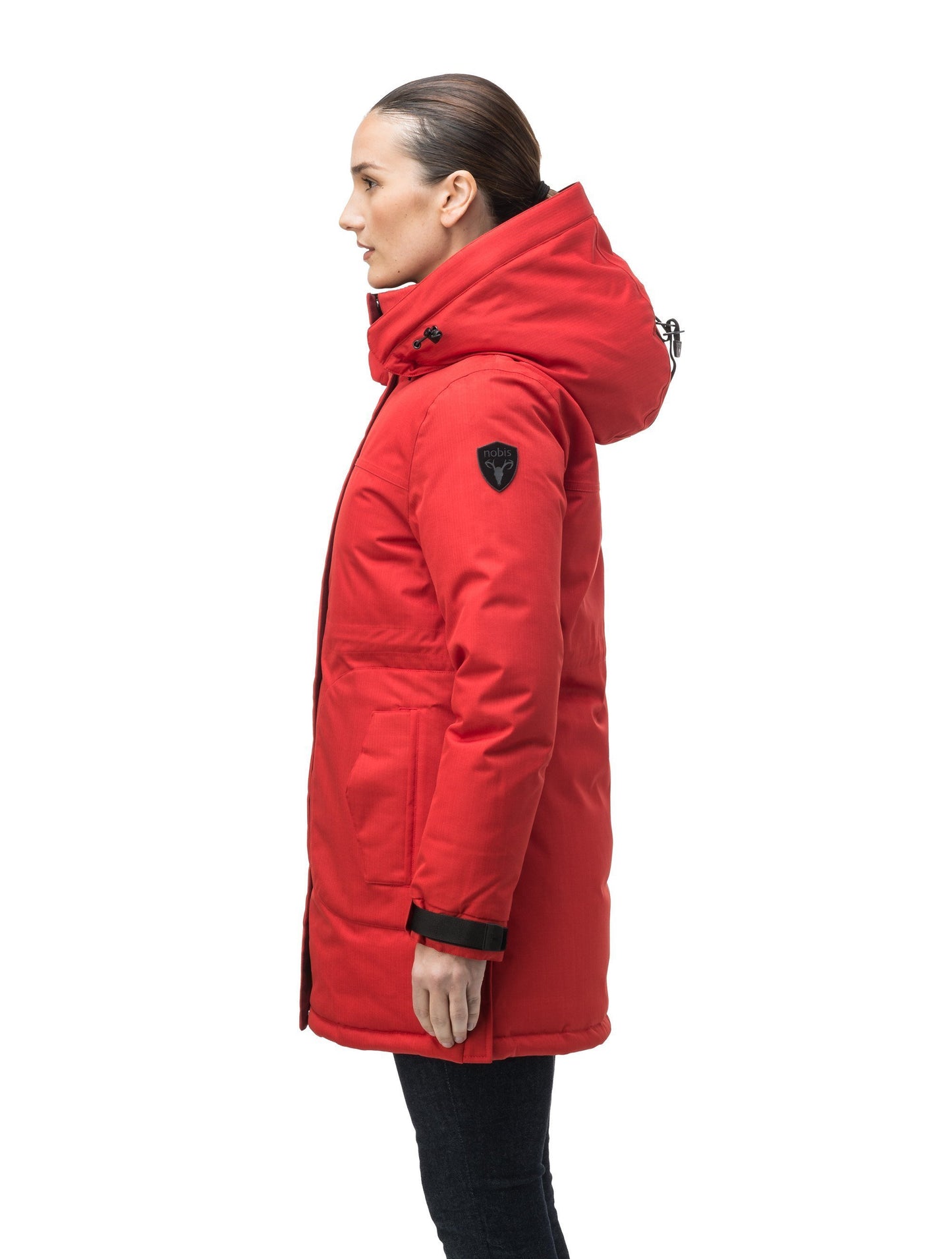 Thigh length women's down filled parka with side entry pockets and drawcord waist, removable hood and fur trim in Vermillion