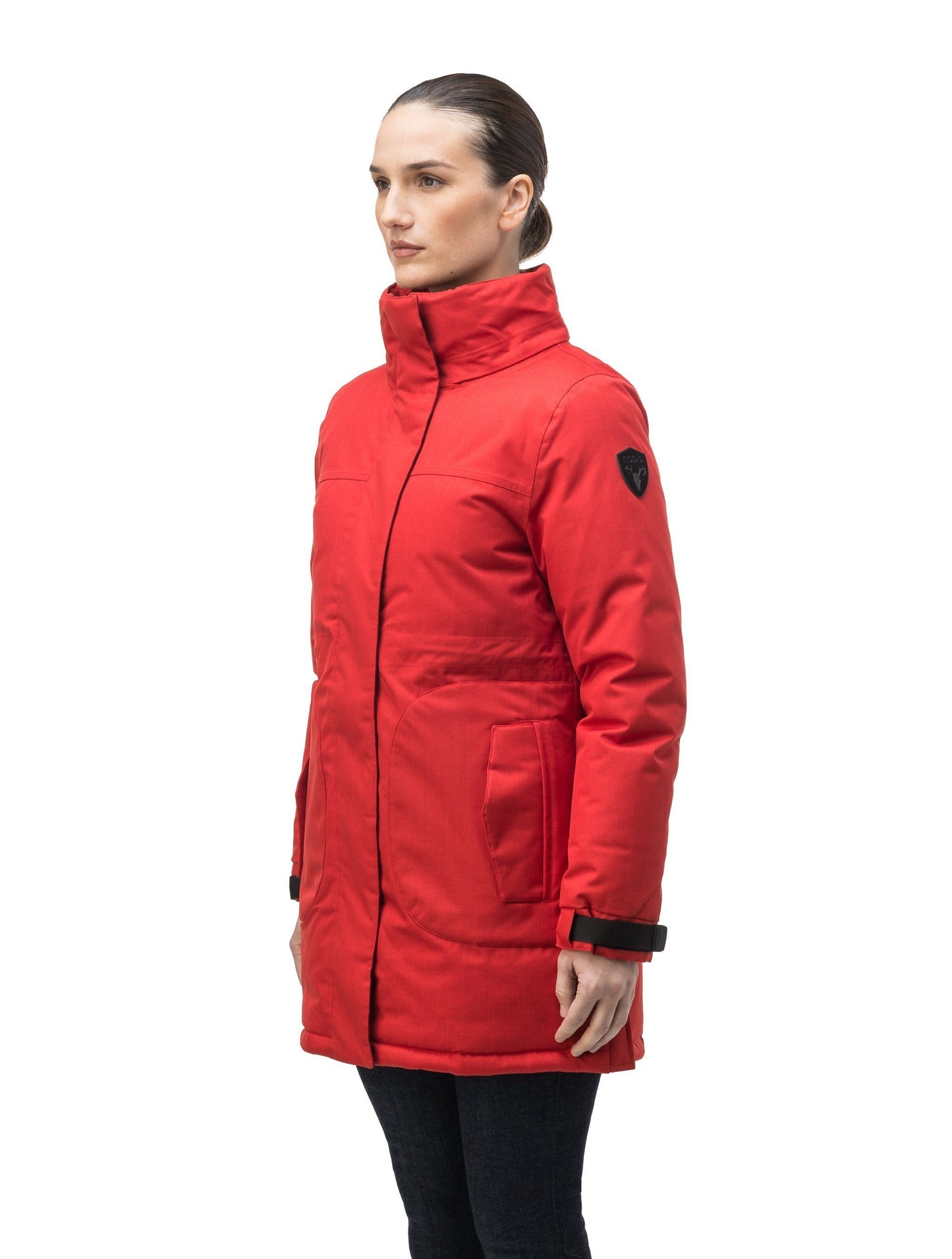 Thigh length women's down filled parka with side entry pockets and drawcord waist, removable hood and fur trim in Vermillion