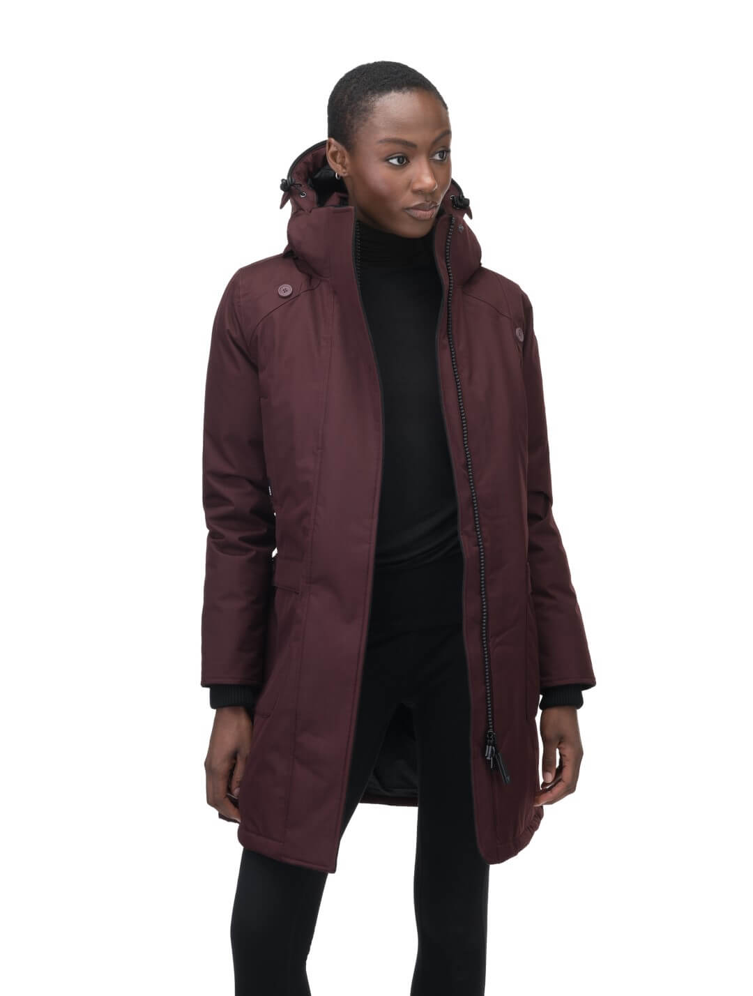 Merideth Furless Ladies Parka in thigh length, Canadian white duck down insulation, removable down-filled hood, centre-front two-way zipper with magnetic wind flap closure, four exterior pockets, and elastic ribbed cuffs, in Merlot