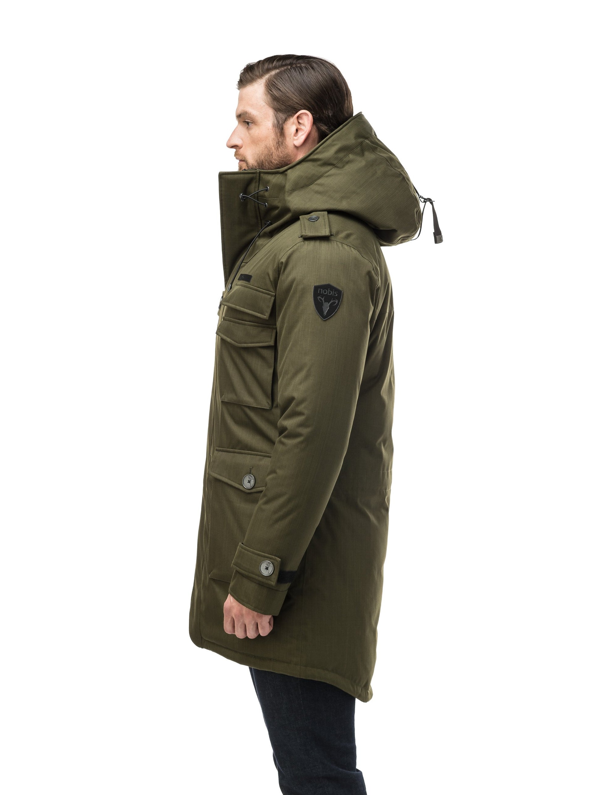 Men's down filled parka with faux button magnet closures and fur free hood with a fishtail hemline in Fatigue