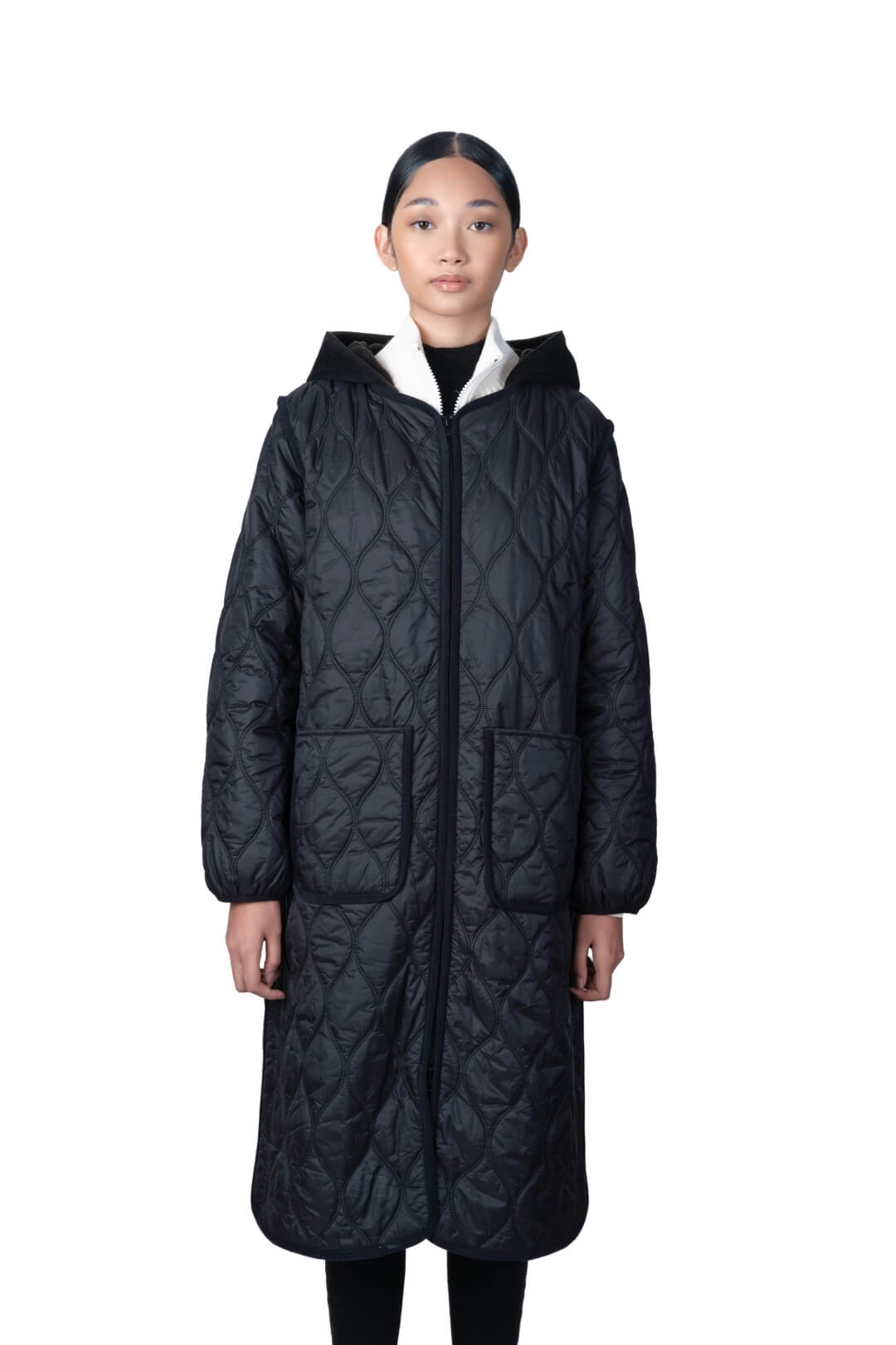 Lunar New Year Ladies Quilted Long Jacket in knee length, sustainable and environmentally friendly Primaloft Gold Insulation Active+, with removable fleece hood, two-way front zipper, two waist patch pockets, and diamond quilted body, in Black