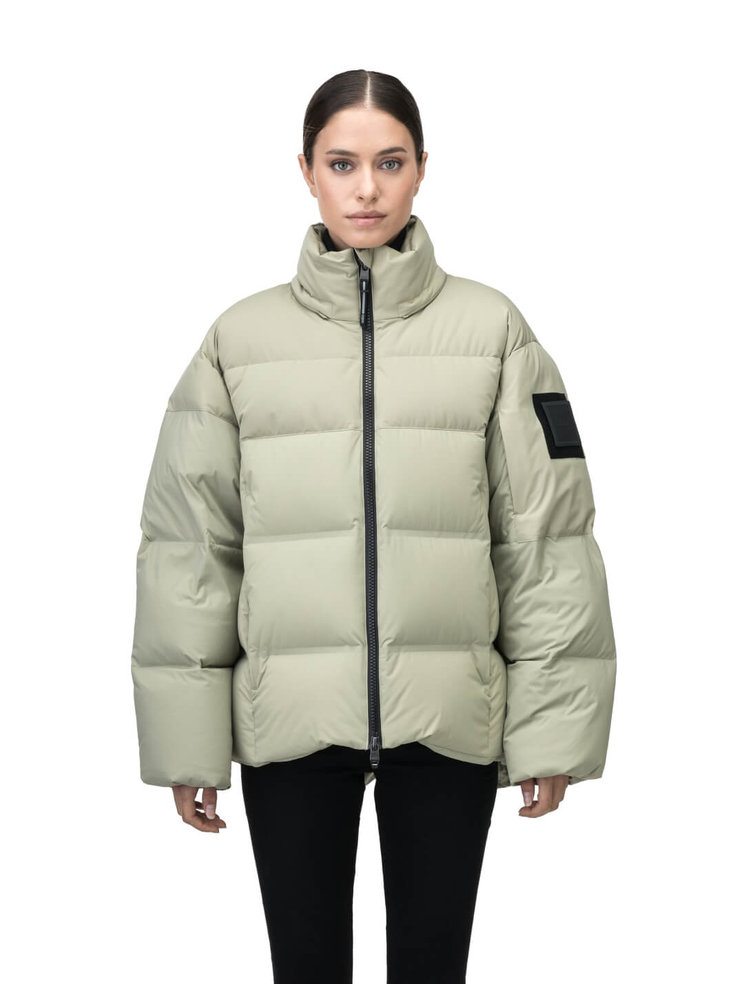 Una Ladies Performance Puffer in hip length, Technical Taffeta and Durable Stretch Ripstop fabrication, Premium Canadian White Duck Down insulation, removable down filled hood, centre front two-way zipper, and side-entry pockets at waist, in Tea