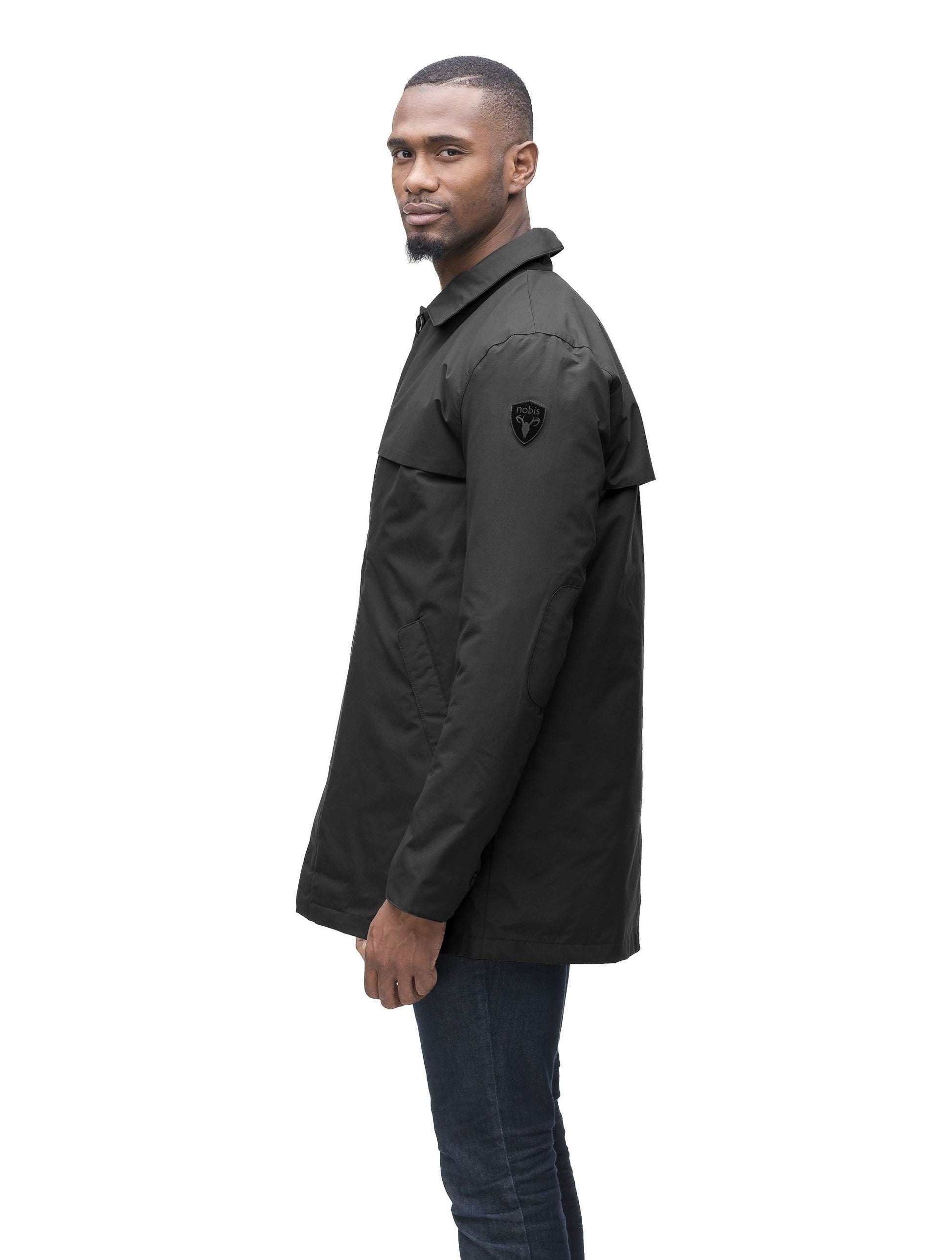 Men's waist length raincoat with a magnetic placket and top button detail in Black