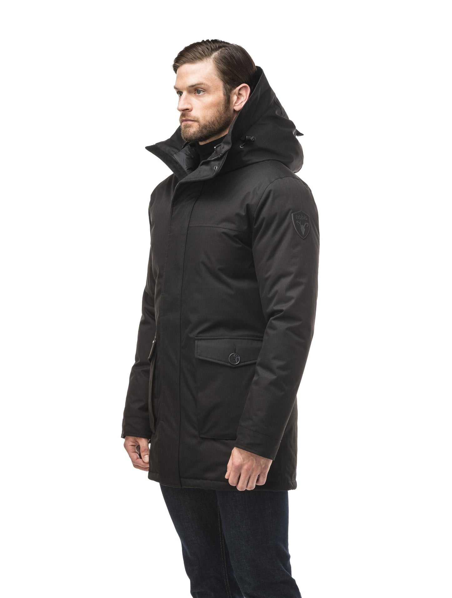 Yves Furless Men's Parka in thigh length, Canadian white duck down insulation, non-removable down-filled hood, flap pockets at waist, centre-front two-way zipper with magnetic wind flap, and elastic ribbed cuffs, in CH Black