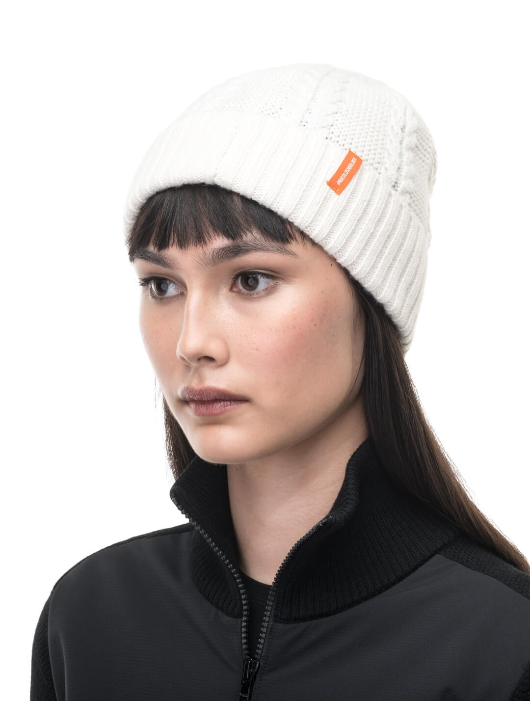 No Cold Shoulder unisex beanie with cable stitched crown, two by two rib knit cuff, with dual orange wrap labels along cuff, in Chalk